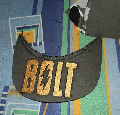 Produced Peak with bolt logo embroidery design