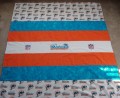 Author: TBQS Creations 
Miami Dolphins Quilt (side 1)
October 2010
Machine embroidery designs by Igor Denisov:
http://www.needlework.ru/