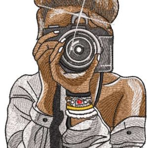 Tanned girl photographer at work embroidery design